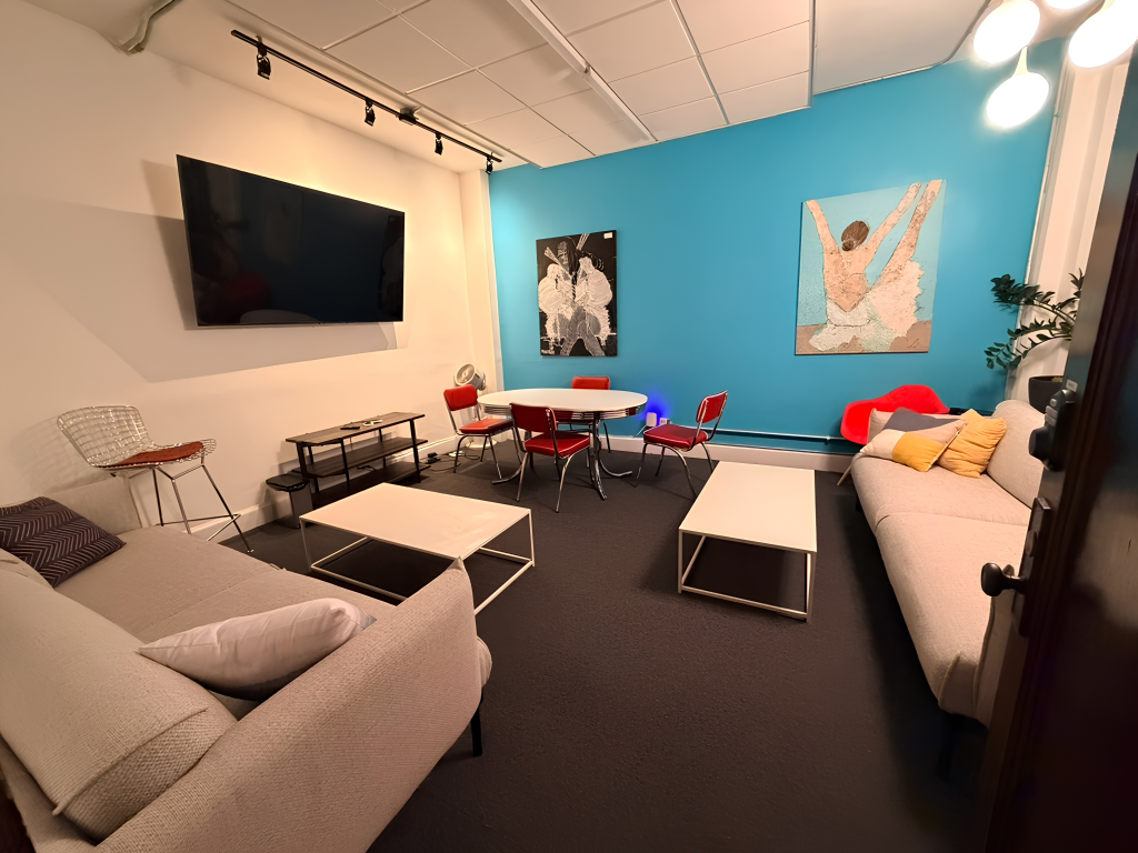 Clubhouse-style meeting room with relaxed seating for small team sessions at Prism Spaces
